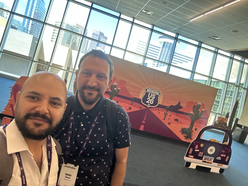 Baljinder Singh and Slavko Suvacar at the WordCamp US 2026 entrance in Phoenix